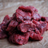 Raw beef chunks on crumpled brown paper